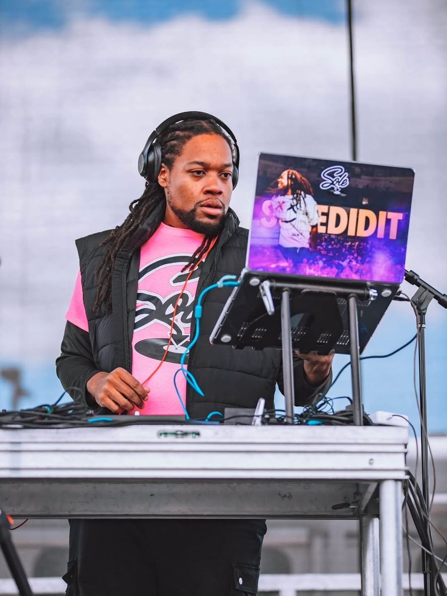 DJ Sole at an outdoor festival booth