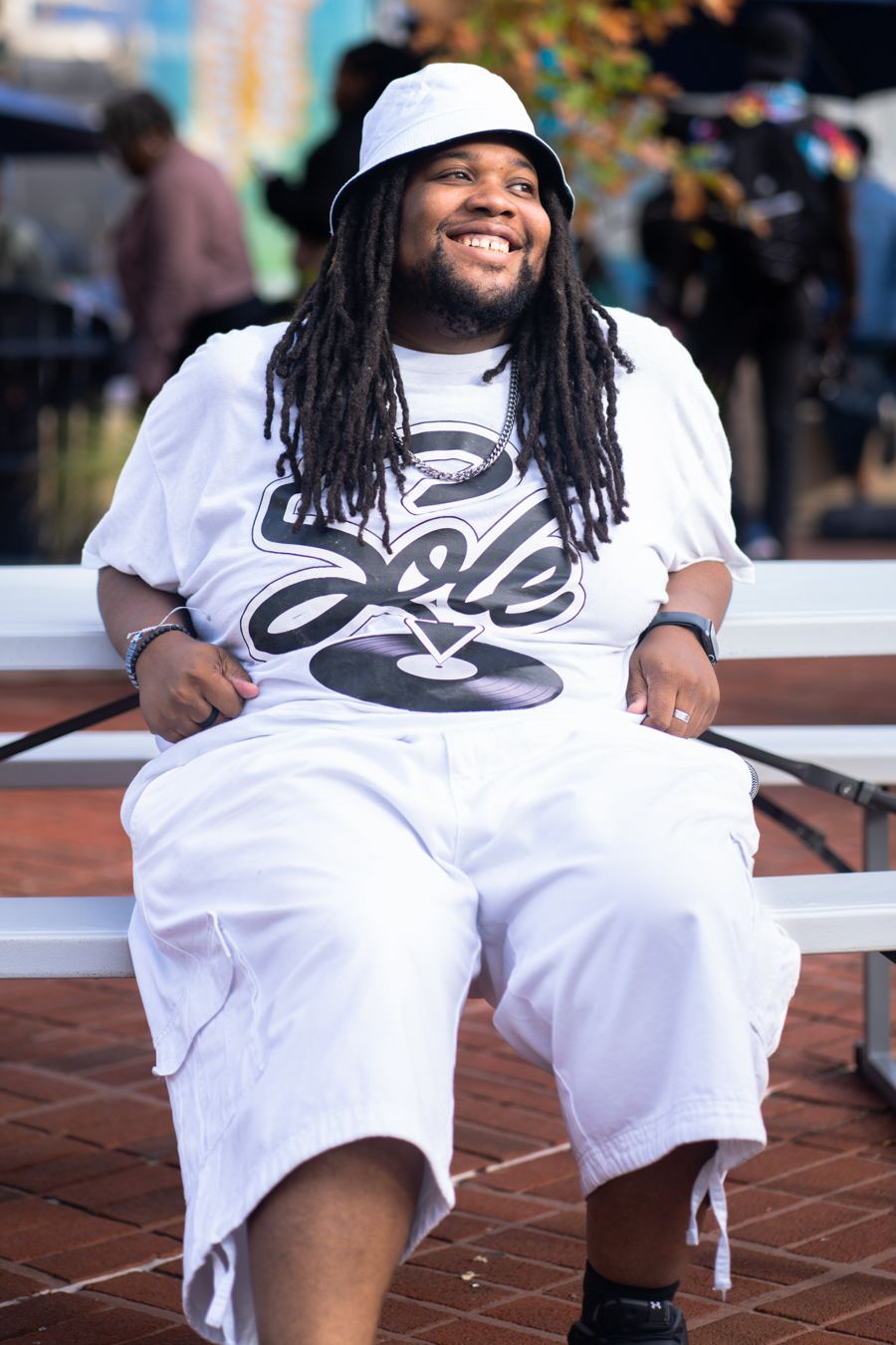 Thomas Jasmine, DJ Sole, smiling in a Sole logo tee